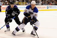 LOS ANGELES, CA - DECEMBER 11:  Alex Steen #20 of the St. Louis Blues is challenged by Drew Doughty #8 of the Los Angeles Kings at the Staples Center on December 11, 2008 in Los Angeles, California.  (Photo by Harry How/Getty Images)