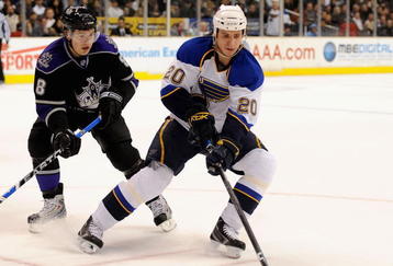 LOS ANGELES, CA - DECEMBER 11:  Alex Steen #20 of the St. Louis Blues is challenged by Drew Doughty #8 of the Los Angeles Kings at the Staples Center on December 11, 2008 in Los Angeles, California.  (Photo by Harry How/Getty Images)