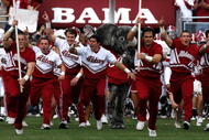 TUSCALOOSA, AL - OCTOBER 24:  The cheerleaders of the Alabama Crimson Tide lead the team onto the field to face the Tennessee Volunteers at Bryant-Denny Stadium on October 24, 2009 in Tuscaloosa, Alabama.  (Photo by Kevin C. Cox/Getty Images)