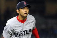 NEW YORK - MAY 05: Takashi Saito #24 of the Boston Red Sox flips the ball to first base for an out against the New York Yankees on May 5, 2009 at Yankee Stadium in the Bronx borough of New York City. The Red Sox defeated the Yankees 7-3. (Photo by Jim McIsaac/Getty Images)