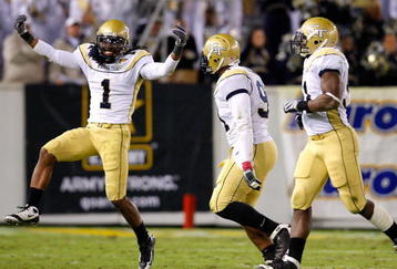 ATLANTA - OCTOBER 17:  Morgan Burnett #1 and Derrick Morgan #91 of the Georgia Tech Yellow Jackets  react after a defensive stop against the Virginia Tech Hokies at Bobby Dodd Stadium on October 17, 2009 in Atlanta, Georgia.  (Photo by Kevin C. Cox/Getty Images)