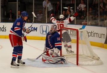 NEW YORK - OCTOBER 22: Nicklas Bergfors #18 of the New Jersey Devils celebrates in front of Marc Staal and Henrik Lundqvist #30 of the New York Rangers after scoring in the first period during the game on October 22, 2009 at Madison Square Garden in New York City. (Photo by Jared Wickerham/Getty Images)