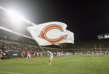 CHICAGO - AUGUST 25: A cheerleader of the Chicago Bears waves a Bears flag during the game against the San Francisco 49ers on August 25, 2007 at Soldier Field in Chicago, Illinois. (Photo by Jonathan Daniel/Getty Images)