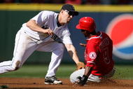 SEATTLE - SEPTEMBER 02:  Chone Figgins #9 of the Los Angeles Angels of Anaheim is tagged out at second base by Jack Wilson #9 of the Seattle Mariners on September 2, 2009 at Safeco Field in Seattle, Washington. (Photo by Otto Greule Jr/Getty Images)