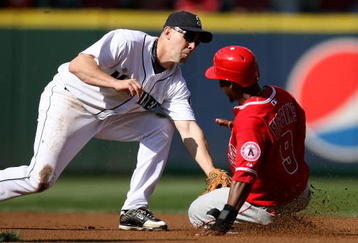 SEATTLE - SEPTEMBER 02:  Chone Figgins #9 of the Los Angeles Angels of Anaheim is tagged out at second base by Jack Wilson #9 of the Seattle Mariners on September 2, 2009 at Safeco Field in Seattle, Washington. (Photo by Otto Greule Jr/Getty Images)