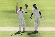 ADELAIDE, AUSTRALIA - DECEMBER 04: Dwayne Bravo (L) of the West Indies celebrates his century during day one of the Second Test match between Australian and the West Indies at Adelaide Oval on December 4, 2009 in Adelaide, Australia.  (Photo by Mark Nolan/Getty Images)