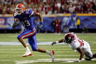 ATLANTA - DECEMBER 06:  David Nelson #83 of the Florida Gators gets past Rashad Johnson #49 of the Alabama Crimson Tide during the SEC Championship on December 6, 2008 at the Georgia Dome in Atlanta, Georgia. The Gators defeated the Crimson Tide 31-20.  (Photo by Chris Graythen/Getty Images)