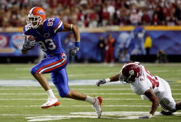 ATLANTA - DECEMBER 06:  David Nelson #83 of the Florida Gators gets past Rashad Johnson #49 of the Alabama Crimson Tide during the SEC Championship on December 6, 2008 at the Georgia Dome in Atlanta, Georgia. The Gators defeated the Crimson Tide 31-20.  (Photo by Chris Graythen/Getty Images)