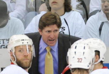 PITTSBURGH - JUNE 9:  Head coach Mike Babcock of the Detroit Red Wings talks to players as Kirk Maltby #18 looks on against the Pittsburgh Penguins during Game Six of the NHL Stanley Cup Finals at the Mellon Arena on June 9, 2009 in Pittsburgh, Pennsylvania. (Photo by: Harry How/Getty Images)