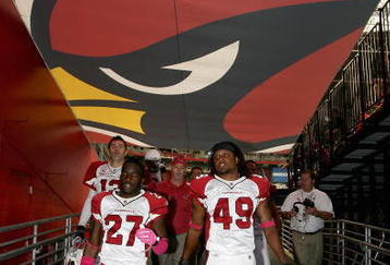 GLENDALE, AZ - OCTOBER 11: (L-R) Kurt Warner #13, Michael Adams #27 and Rashad Johnson #49 of the Arizona Cardinals walk off the field following warm ups to the NFL game against the Houston Texans at the Universtity of Phoenix Stadium on October 11, 2009 in Glendale, Arizona. (Photo by Christian Petersen/Getty Images)