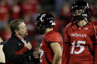CINCINNATI - NOVEMBER 13: Head coach Brian Kelly of the the Cincinnati Bearcats speaks to quarterback Zach Collaros #12 with quarterback Tony Pike standing by during warm ups before the game against the West Virginia Mountaineers at Nippert Stadium on November 13, 2009 in Cincinnati, Ohio. (Photo by Andy Lyons/Getty Images)