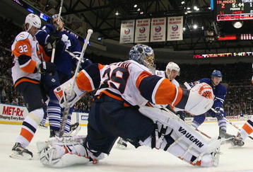 UNIONDALE, NY - DECEMBER 26: Rick DiPietro #39 of the New York Islanders tends the net against the Toronto Maple Leafs on December 26, 2008 at the Nassau Coliseum in Uniondale, New York. (Photo by Bruce Bennett/Getty Images)