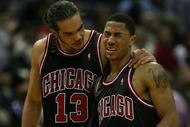 MILWAUKEE - NOVEMBER 30: Joakim Noah #13 of the Chicago Bulls consoles teammate Derrick Rose #1 during a time-out after Rose was fouled during a game against the Milwaukee Bucks at the Bradley Center on November 30, 2009 in Milwaukee, Wisconsin. The Bucks defeated the Bulls 99-97. NOTE TO USER: User expressly acknowledges and agrees that, by downloading and/or using this Photograph, User is consenting to the terms and conditions of the Getty Images License Agreement. (Photo by Jonathan Daniel/Getty Images)