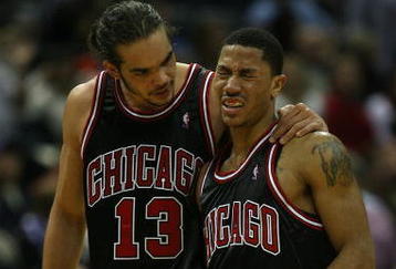 MILWAUKEE - NOVEMBER 30: Joakim Noah #13 of the Chicago Bulls consoles teammate Derrick Rose #1 during a time-out after Rose was fouled during a game against the Milwaukee Bucks at the Bradley Center on November 30, 2009 in Milwaukee, Wisconsin. The Bucks defeated the Bulls 99-97. NOTE TO USER: User expressly acknowledges and agrees that, by downloading and/or using this Photograph, User is consenting to the terms and conditions of the Getty Images License Agreement. (Photo by Jonathan Daniel/Getty Images)