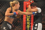 SAN JOSE, CA - AUGUST 15:  Cris Cyborg (L) battles Gina Carano during their Middleweight Championship fight at Stikeforce: Carano vs. Cyborg on August 15, 2009 in San Jose, California.  (Photo by Jon Kopaloff/Getty Images)