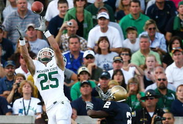 SOUTH BEND, IN - SETPEMBER 19: Blair White #25 of the Michigan State Spartans catches a touchdown pass over Darrin Walls #2 of the Notre Dame Fighting Irish on September 19, 2009 at Notre Dame Stadium in South Bend, Indiana. Notre Dame defeated Michigan State 33-30. (Photo by Jonathan Daniel/Getty Images)