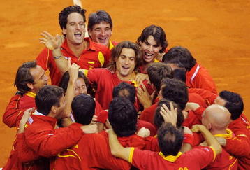 BARCELONA, SPAIN - DECEMBER 05: Feliciano Lopez (L), David Ferrer (C) and Rafael Nadal (R) of Spain celebrate with their team mates after Feliciano Lopez and Fernando Verdasco of Spain beat Radek Stepanek and Tomas Berdych of Czech Republic during the Davis Cup World Group Final doubles match at Palau Sant Jordi stadium on December 5, 2009 in Barcelona, Spain. Spain won the Davis Cup after leading Czech Republic 3-0. (Photo by Denis Doyle/Getty Images)