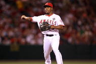 ANAHEIM, CA - AUGUST 11:  Chone Figgins #9 of the Los Angeles Angels of Anaheim throws to first against the Tampa Bay Rays on August 11, 2009 at Angel Stadium in Anaheim, California.  The Angels won 6-0.  (Photo by Stephen Dunn/Getty Images)