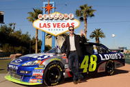 LAS VEGAS - DECEMBER 02:  2009 NASCAR Sprint Cup Series Champion Jimmie Johnson poses with the trophy next to the #48 Lowe's Chevrolet during Day 1 of the NASCAR Sprint Cup Series Champions Week on December 2, 2009 in Las Vegas, Nevada.  (Photo by Rusty Jarrett/Getty Images for NASCAR)