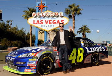 LAS VEGAS - DECEMBER 02:  2009 NASCAR Sprint Cup Series Champion Jimmie Johnson poses with the trophy next to the #48 Lowe's Chevrolet during Day 1 of the NASCAR Sprint Cup Series Champions Week on December 2, 2009 in Las Vegas, Nevada.  (Photo by Rusty Jarrett/Getty Images for NASCAR)