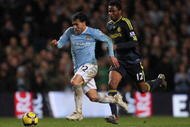 MANCHESTER, ENGLAND - DECEMBER 05: Carlos Tevez of Manchester City surges away from John Obi Mikel of Chelsea during the Barclays Premier League match between Manchester City and Chelsea at the City of Manchester Stadium on December 5, 2009 in Manchester, England. (Photo by Alex Livesey/Getty Images)