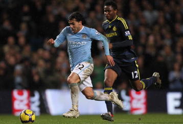 MANCHESTER, ENGLAND - DECEMBER 05:  Carlos Tevez of Manchester City surges away from John Obi Mikel of Chelsea during the Barclays Premier League match between Manchester City and Chelsea at the City of Manchester Stadium on December 5, 2009 in Manchester, England.  (Photo by Alex Livesey/Getty Images)