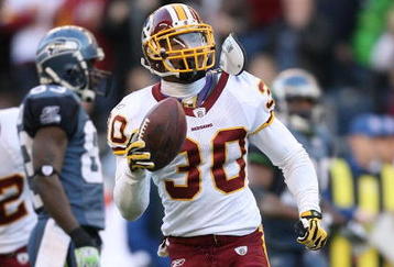 SEATTLE - NOVEMBER 23:  Safety LaRon Landry #30 of the Washington Redskins celebrates after making an interception  against the Seattle Seahawks on November 23, 2008 at Qwest Field in Seattle, Washington. The Redskins defeated the  20-17. (Photo by Otto Greule Jr/Getty Images)