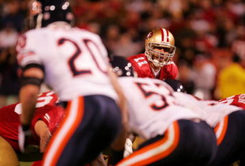 SAN FRANCISCO - NOVEMBER 12: Quarterback Alex Smith #11 of the San Francisco 49ers under center against the Chicago Bears at Candlestick Park on November 12, 2009 in San Francisco, California.  (Photo by Ezra Shaw/Getty Images)
