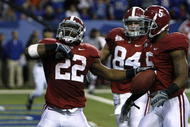 ATLANTA - DECEMBER 5:  (L-R) Mark Ingram #22, Colin Peek #84 and Roy Upchurch #5 of the Alabama Crimson Tide celebrate after Ingram scored a 3-yard rushing touchdown in the second quarter against the Florida Gators during the SEC Championship game at Georgia Dome on December 5, 2009 in Atlanta, Georgia.  (Photo by Chris Graythen/Getty Images)
