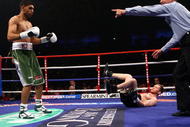 NEWCASTLE UPON TYNE, ENGLAND - DECEMBER 05:  Amir Khan knocks down Dmitriy Salita of the U.S. in the first round to retain his WBA Light Welterweight title on December 5, 2009 in Newcastle upon Tyne, England.  (Photo by John Gichigi/Getty Images)