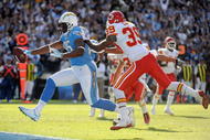 SAN DIEGO - NOVEMBER 29:  Antonio Gates #85 of the San Diego Chargers scores a touchdown for a 7-0 lead past Brandon Carr #39 of the Kansas City Chiefs during the first quarter at Qualcomm Stadium on November 29, 2009 in San Diego, California.  (Photo by Harry How/Getty Images)