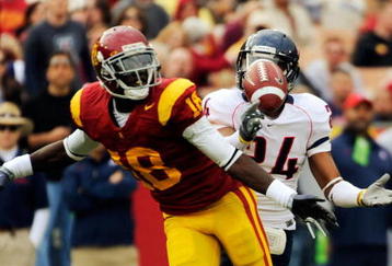LOS ANGELES, CA - DECEMBER 05:  CornerbackTrevin Wade #24 of the Arizona Wildcats intercepts a pass intended for wide receiver Damian Williams #18 of the USC Trojans during the first quarter of the NCAA college football game at the Los Angeles Coliseum on December 5, 2009 in Los Angeles, California.  (Photo by Kevork Djansezian/Getty Images)