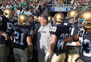 SOUTH BEND, IN - NOVEMBER 21: Head coach Charlie Weis of the Notre Dame Fighting Irish stands with his team before lining up to enter the field for a game against the University of Connecticut Huskies at Notre Dame Stadium on November 21, 2009 in South Bend, Indiana. (Photo by Jonathan Daniel/Getty Images)