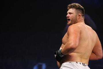 UNCASVILLE, CT - MAY 16:  Roy Nelson (White Trunks) of the Lions Den celebrates after beating Brad Imes MilesTech Fighting System during their bout presented by the International Fighting League at the Mohegan Sun Arena May 16, 2008 in Uncasville, Connecticut.  (Photo by Al Bello/Getty Images)
