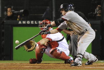 ANAHEIM, CA - OCTOBER 09:  Dustin Pedroia  #15 of the Boston Red Sox at bat against the Los Angeles Angels of Anaheim in Game Two of the ALDS during the 2009 MLB Playoffs at Angel Stadium on October 9, 2009 in Anaheim, California. (Photo by Lisa Blumenfeld/Getty Images)  (Photo by Jacob de Golish/Getty Images)