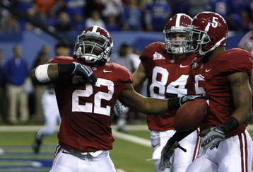 ATLANTA - DECEMBER 5:  (L-R) Mark Ingram #22, Colin Peek #84 and Roy Upchurch #5 of the Alabama Crimson Tide celebrate after Ingram scored a 3-yard rushing touchdown in the second quarter against the Florida Gators during the SEC Championship game at Georgia Dome on December 5, 2009 in Atlanta, Georgia.  (Photo by Chris Graythen/Getty Images)