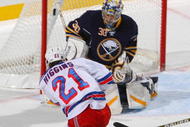 BUFFALO, NY - DECEMBER 05: Christopher Higgins #21  of the New York Rangers scores on Ryan Miller #30 of the Buffalo Sabres in the first period at HSBC Arena on December 5, 2009 in Buffalo, New York.  (Photo by Rick Stewart/Getty Images)