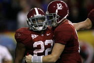 ATLANTA - DECEMBER 5:  (L-R) Mark Ingram #22 and quarterback Greg McElroy #12 of the Alabama Crimson Tide celebrate after Ingram scored a 1-yard touchdown in the fourth quarter against the Florida Gators during the SEC Championship game at Georgia Dome on December 5, 2009 in Atlanta, Georgia.  (Photo by Kevin C. Cox/Getty Images)