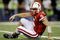 ARLINGTON, TX - DECEMBER 5: Quarterback Zac Lee of the Nebraska Cornhuskers reacts on the ground after being sacked in the first quarter against the Texas Longhorns at Cowboys Stadium on December 5, 2009 in Arlington, Texas.  (Photo by Jamie Squire/Getty Images)