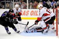 LOS ANGELES, CA - DECEMBER 03:  Brad Richardson #15 of the Los Angeles Kings scores a goal against Filip Kuba #17 of the Ottawa Senators as goalkeeper Brian Elliott #30 defends during the second period of the NHL hockey game on December 3, 2009 in Los Angeles, California.  Following the action is Erik Karlsson  of the Ottawa Senators. (Photo by Kevork Djansezian/Getty Images)