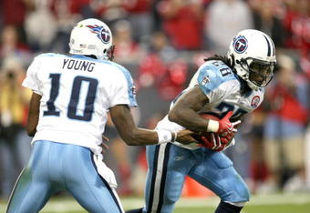 HOUSTON - NOVEMBER 23:  Running Back Chris Johnson #28 of the Tennessee Titans takes a handoff from quarterback Vince Young #10 against the Houston Texans on November 23, 2009  at Reliant Stadium in Houston, Texas.  The Titans won 20-17.  (Photo by Stephen Dunn/Getty Images)