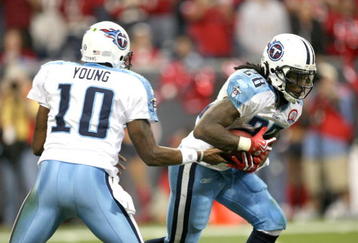 HOUSTON - NOVEMBER 23:  Running Back Chris Johnson #28 of the Tennessee Titans takes a handoff from quarterback Vince Young #10 against the Houston Texans on November 23, 2009  at Reliant Stadium in Houston, Texas.  The Titans won 20-17.  (Photo by Stephen Dunn/Getty Images)