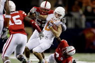 ARLINGTON, TX - DECEMBER 5:  Jordan Shipley #8 of the Texas Longhorns is stopped by Phillip Dillard #52 and Larry Asante #4 of the Nebraska Cornhuskers for a 15-yard penalty in the final minutes of the game at Cowboys Stadium on December 5, 2009 in Arlington, Texas.  Texas won the game 10-6.  (Photo by Jamie Squire/Getty Images)