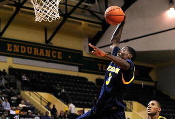 ORLANDO, FL - NOVEMBER 27:  Manny Harris #3 of the Michigan Wolverines attempts a shot against the Marquette Golden Eagles during the Old Spice Classic at Disney's Milk House on November 27, 2009 in Orlando, Florida. Marquette defeated Michigan 79-65.  (Photo by Sam Greenwood/Getty Images)