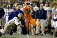 TAMPA, FL - DECEMBER 05:  Running back C.J. Spiller #28 of the Clemson Tigers runs the ball as defensive back Mario Butler #2 of the Georgia Tech Yellow Jackets knocks him out of bounds in the 2009 ACC Football Championship game at Raymond James Stadium on December 5, 2009 in Tampa, Florida.  (Photo by J. Meric/Getty Images)
