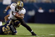 ST. LOUIS - NOVEMBER 15: Mike Bell #21 of the New Orleans Saints is tackled by Quincy Butler #36 of the St. Louis Rams at the Edward Jones Dome on November 15, 2009 in St. Louis, Missouri. The Saints beat the Rams 28-23. (Photo by Dilip Vishwanat/Getty Images)