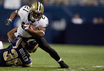 ST. LOUIS - NOVEMBER 15: Mike Bell #21 of the New Orleans Saints is tackled by Quincy Butler #36 of the St. Louis Rams at the Edward Jones Dome on November 15, 2009 in St. Louis, Missouri.  The Saints beat the Rams 28-23.  (Photo by Dilip Vishwanat/Getty Images)