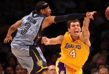 LOS ANGELES, CA - NOVEMBER 06:  Allen Iverson #3 of the Memphis Grizzlies and Luke Walton #4 of the Los Angeles Lakers o for a loose ball on November 6, 2009 at Staples Center in Los Angeles, California. The Lakers won 114-98. NOTE TO USER: User expressly acknowledges and agrees that, by downloading and/or using this Photograph, user is consenting to the terms and conditions of the Getty Images License Agreement.  (Photo by Stephen Dunn/Getty Images)