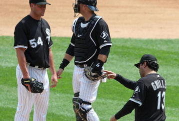 CHICAGO - JUNE 08: Manager Ozzie Guillen #13 of the Chicago White Sox calls for a relief pitcher as he removes starting pitcher Clayton Richard #54 from a game against the Detroit Tigers as A.J. Pierzynski #12 looks to the bullpen on June 8, 2009 at U.S. Cellular Field in Chicago, Illinois. The Tigers defeated the White Sox 5-4. (Photo by Jonathan Daniel/Getty Images)