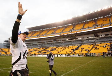 PITTSBURGH - DECEMBER 05: Tony Pike #15 of the Cincinnati Bearcats waves to fans while he walks off he field after their win against the University of Pittsburgh Panthers on December 5, 2009 at Heinz Field in Pittsburgh, Pennsylvania.  (Photo by Jared Wickerham/Getty Images)